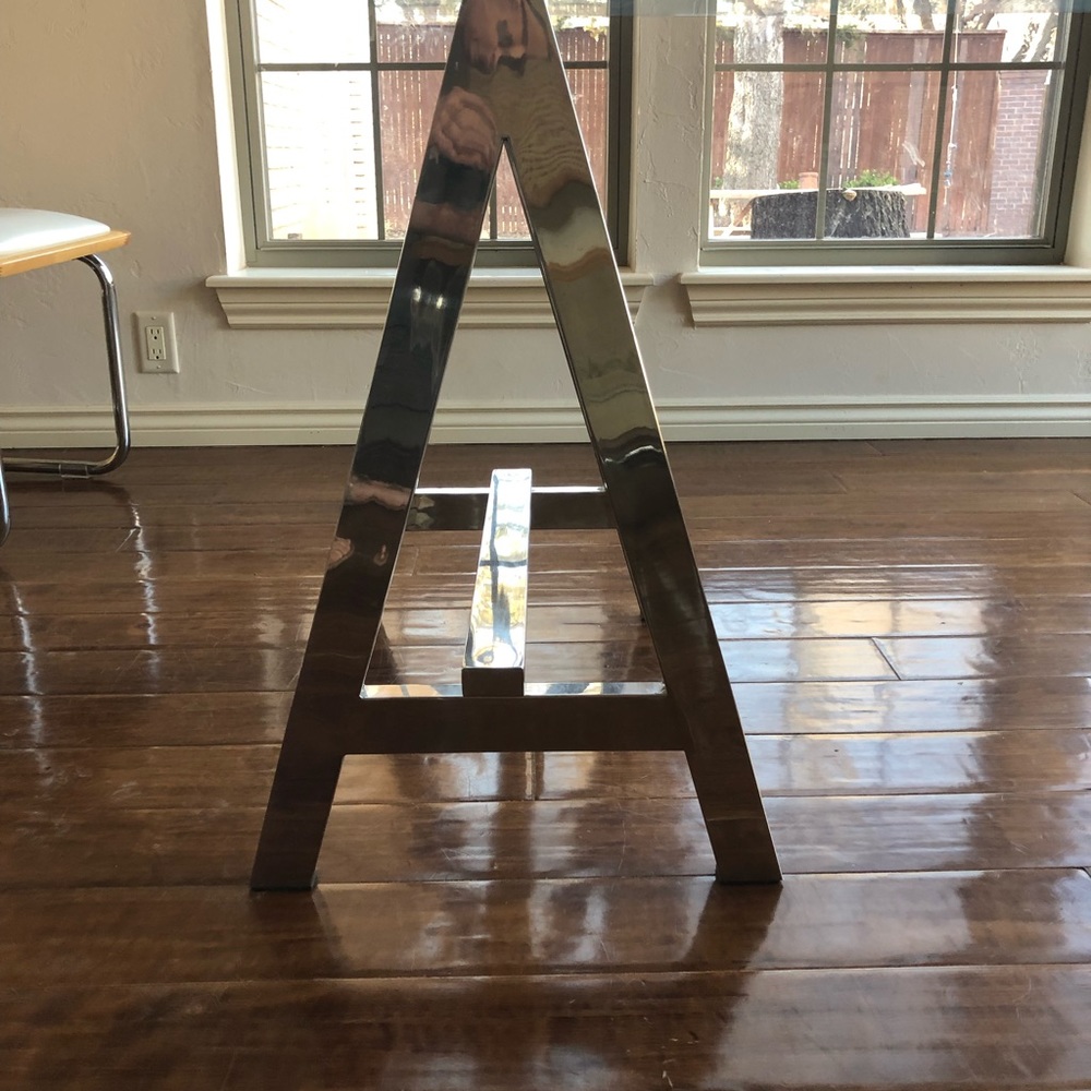 Glass top table with metal legs fits 6 easily.